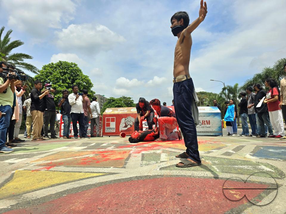 Demonstrators outside the parliament in Dhaka, protesting the shooting of one student by the police during their rally