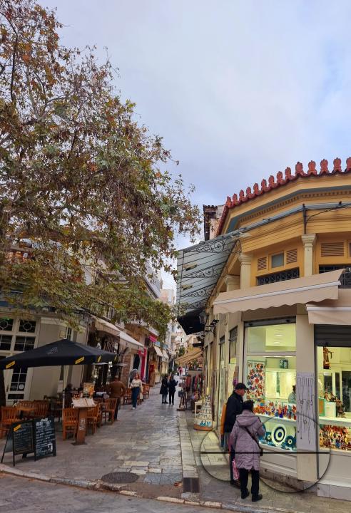 Street shops of artefacts being browsed by tourists in Athens