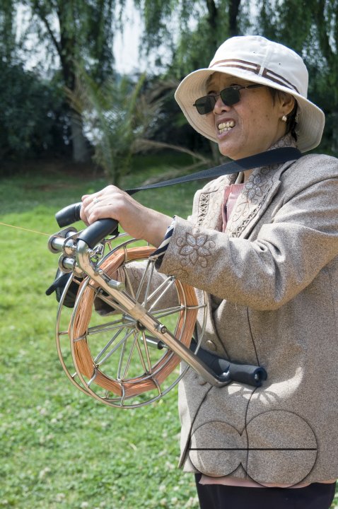 CHINA Elderly people flying kites in a park in Kunming, Yunnan province..