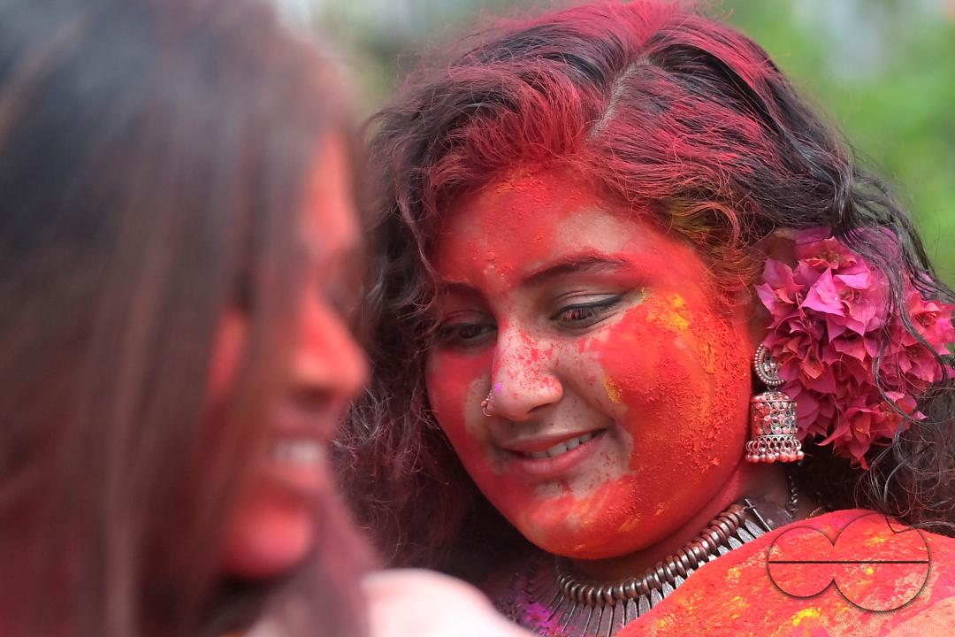 Indian girls adorned with 'Gulal' or coloured powder during the Hindu spring festival 'Holi', the festival of colour in Agartala