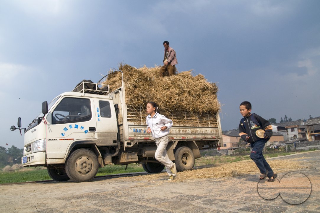 CHINA Truck loaded with hay during harvest time in Yunnan province.