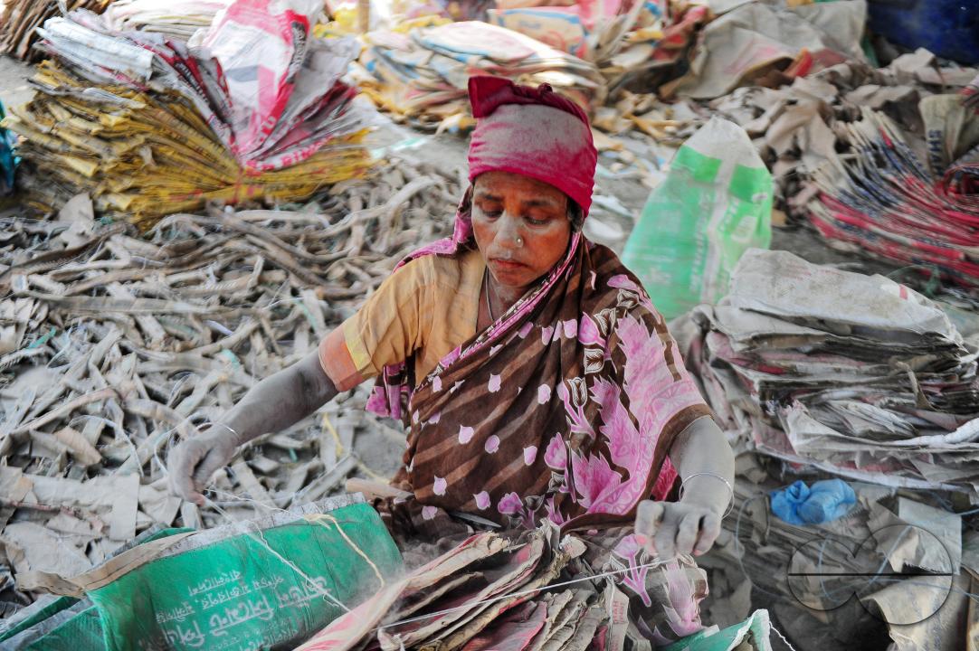 Women are risking their lives to wash cement bags beside the Surma River in Sylhet
