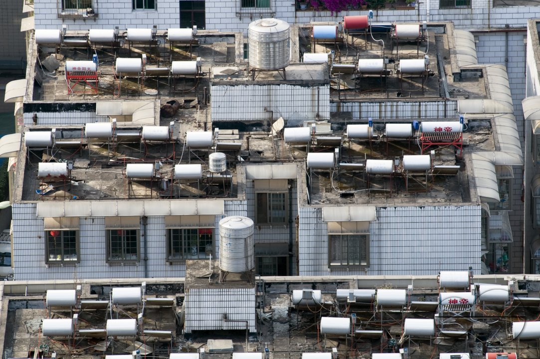 CHINA Solar panels installed on roofs of apartment buildings and offices in Kunming, Yunnan province.