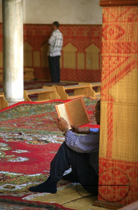 A man reading from the Quran in a mosque in Fez, Morocco. October 2, 2006.