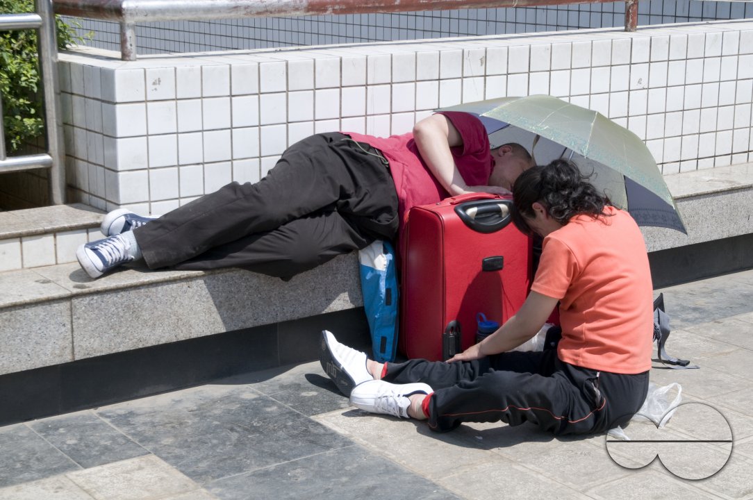 CHINA Migrant workers from the countryside waiting outside Guangzhou train station, Guangdong province.