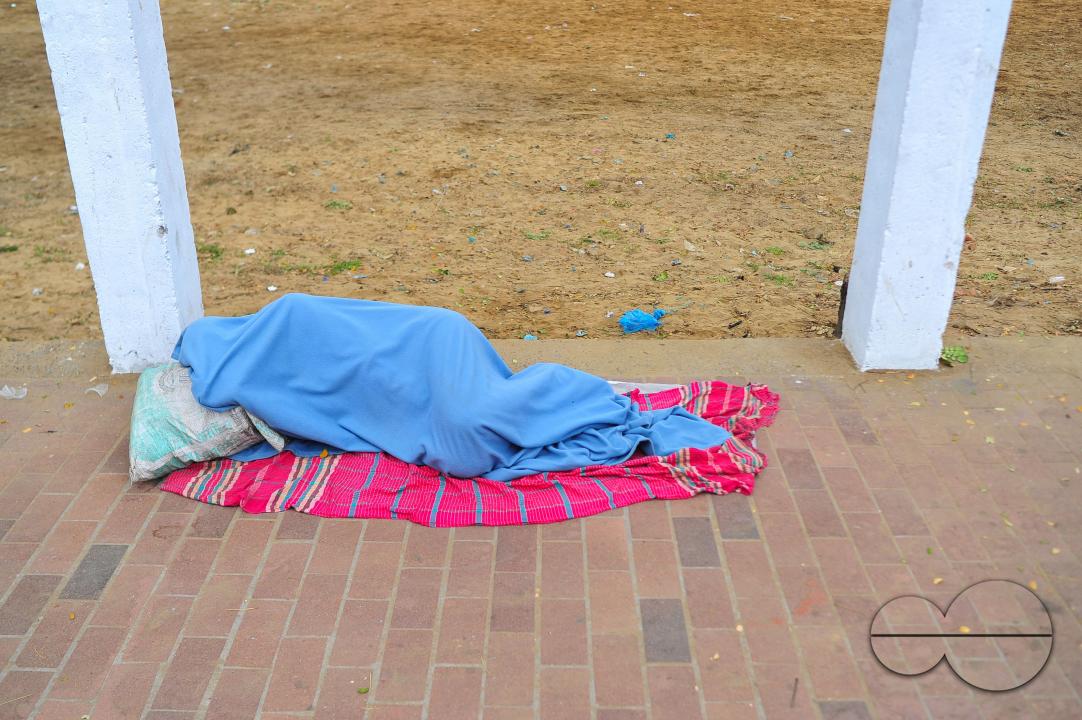 Covering their bodies from head to toe with whatever they can manage, homeless people sleep out in the open in the shivering cold near the Government Alia Madrasa in Sylhet city's Chowhatta area