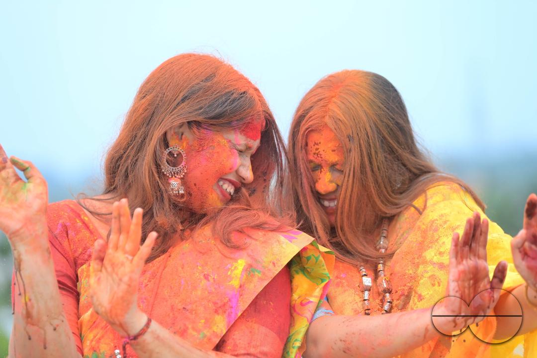 Indian girls adorned with 'Gulal' or coloured powder during the Hindu spring festival 'Holi', the festival of colour in Agartala