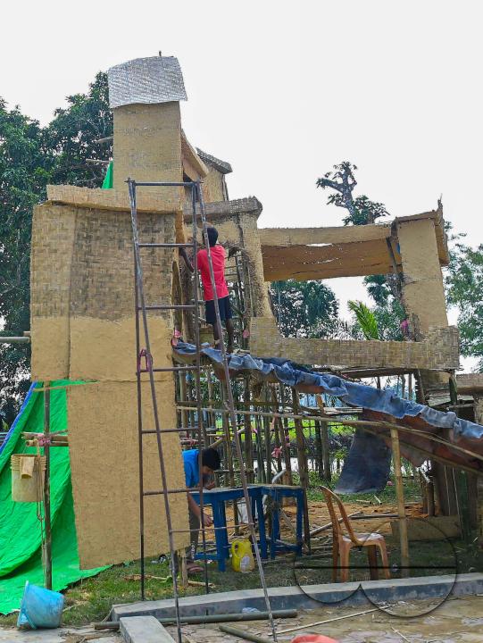 People decorate a church in preparation for Christmas Day at Mariam Church, Agartala