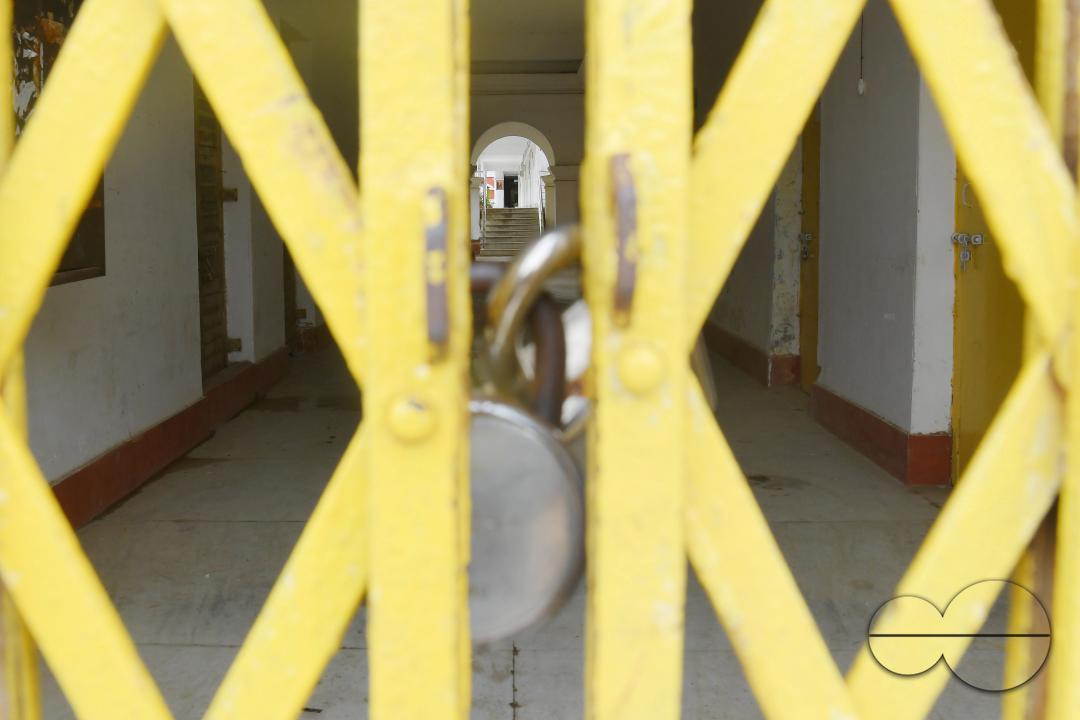 A locked gate of a government school during cyclone MidhiliÂ in Agartala
