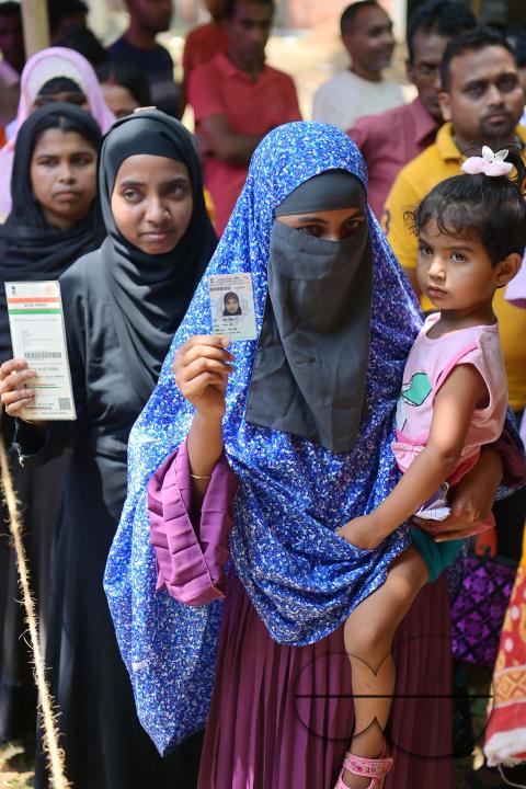 Muslim voters patiently await their turn to cast their votes at a Boxanagar polling station in Agartala in the first phase of Lok Sabha elections