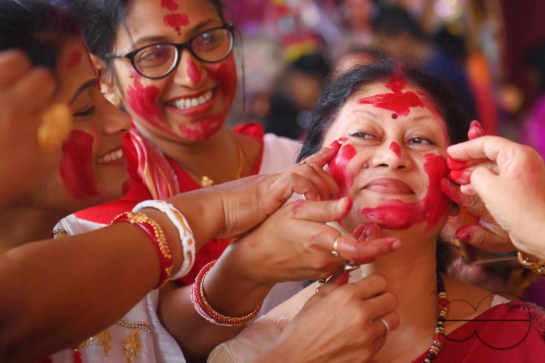 Married ladies smear red Sindoor or Vermillion, a ritual known as Sindur Khela or Vermillion Game on Vijayadashami, the last day of the Durga Puja festival