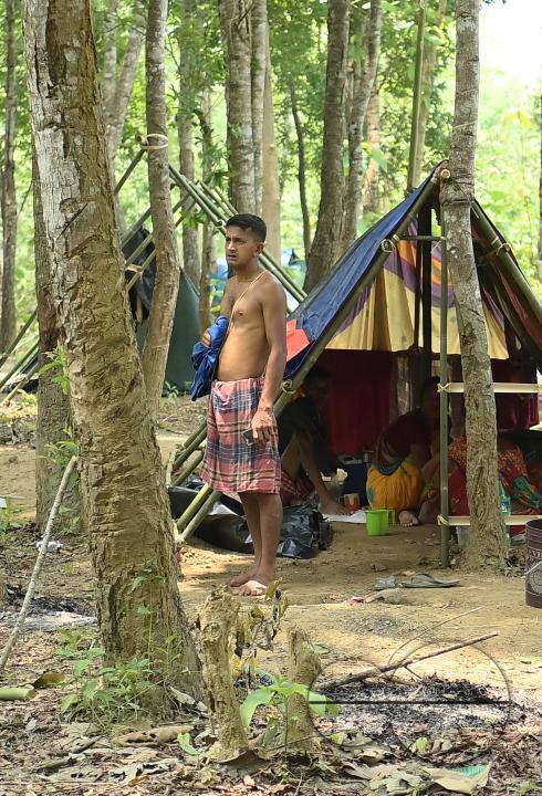 People in makeshift tents at Panisagar's reserve forest area
