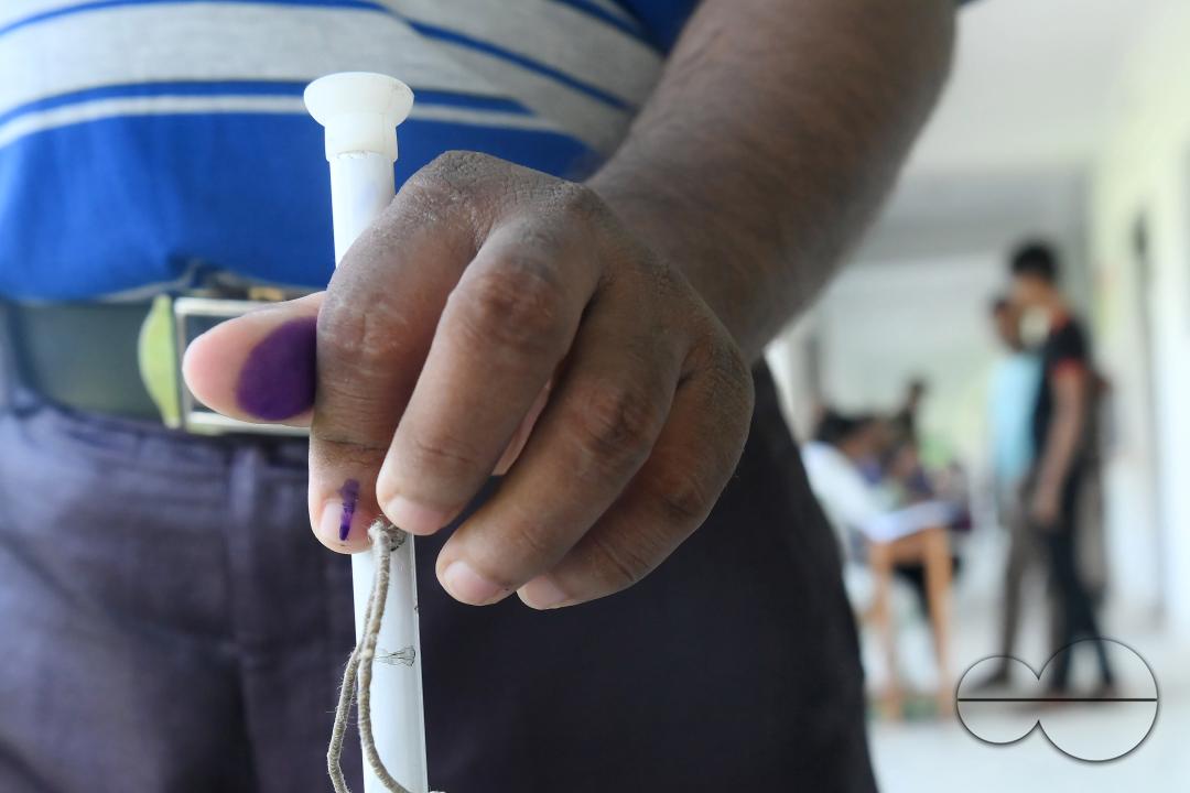 A blind voter at the by-elections for the Boxonagar assembly seat, in Tripura Sepahijala district