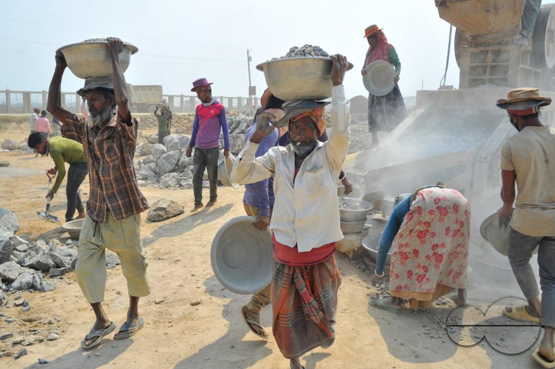 Male and female workers are breaking LC stones with a crusher machine in Bholaganj area, known as the 'Stone State' of Sylhet Companyganj Upazila