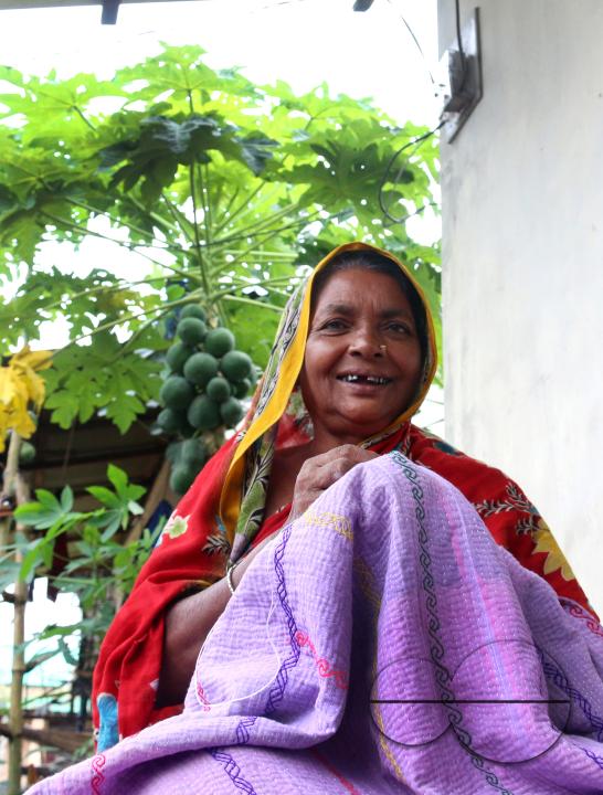 Rural Bangladeshi women sewing and embroidering bed sheets, pillow cases, rugs, table cloths and other household items which is their livelihood
