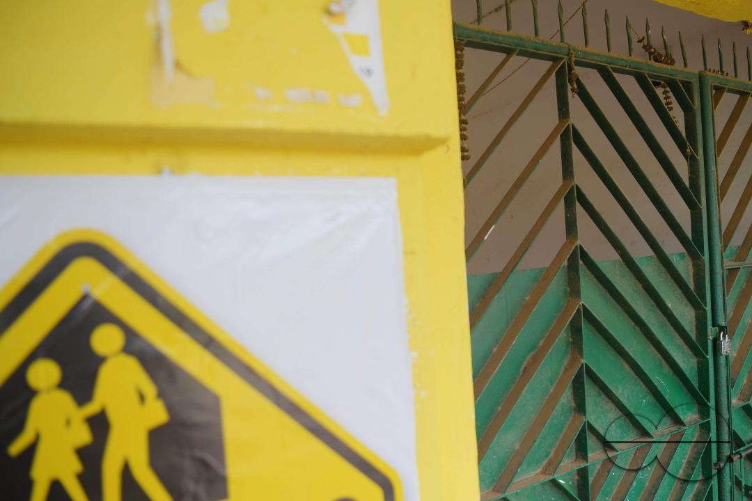A locked gate of a government school during cyclone MidhiliÂ in Agartala