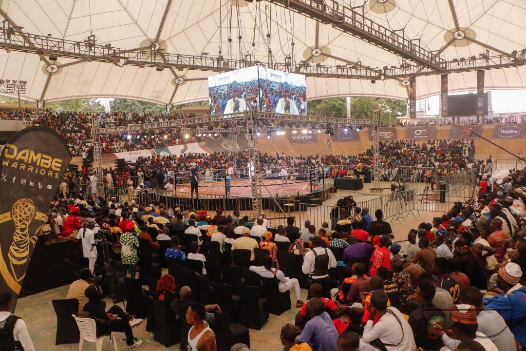 People watch Dambe boxers fight during the Dambe Warriors Supper fight 3 Tournament in Abuja, Nigeria.