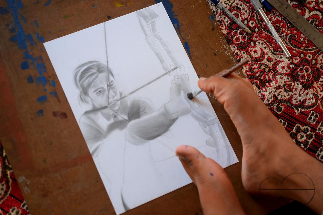 A 23-year-old differently abled artist Pralay Dey, is pursuing his bachelorâs degree in psychology from Tripura Central University
