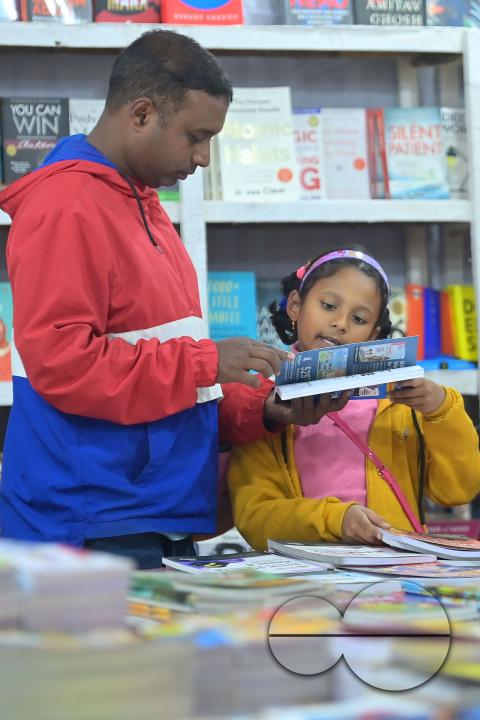 People looking at books in a book stall at the 42nd Agartala Book fair International Fair Ground, Hapania at Agartala