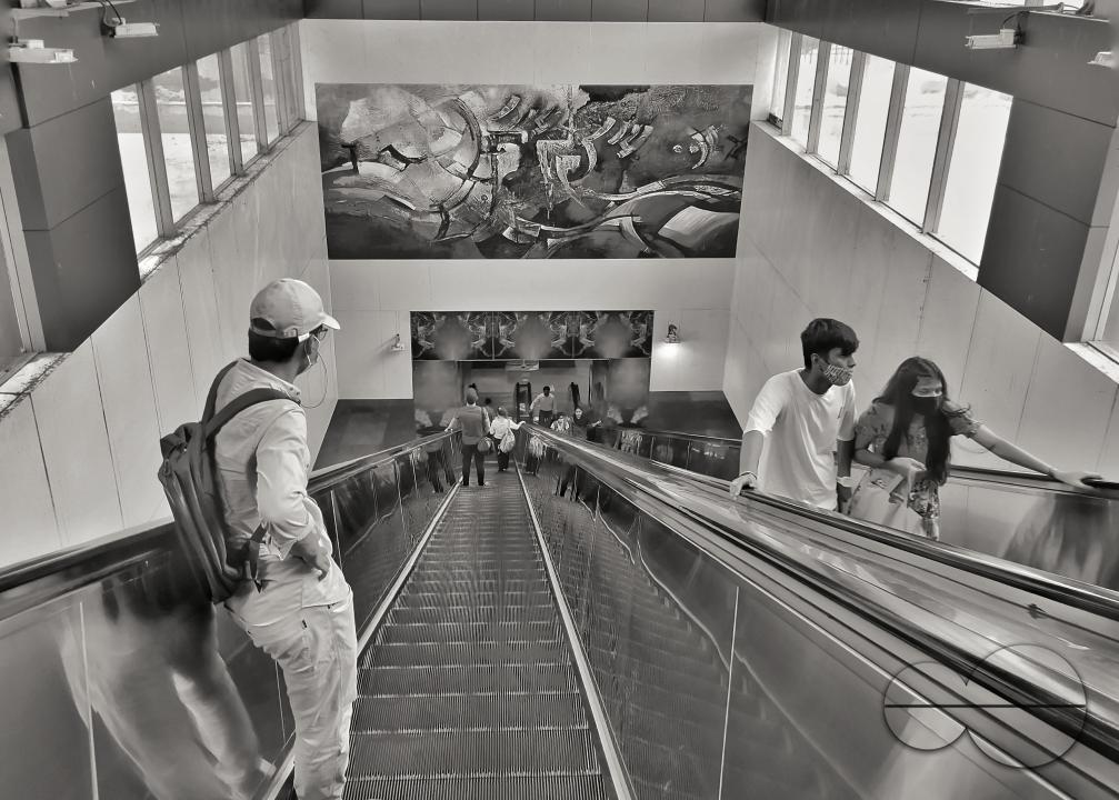 A Rohingya student on an escalator at the metro station of New Delhi, India.